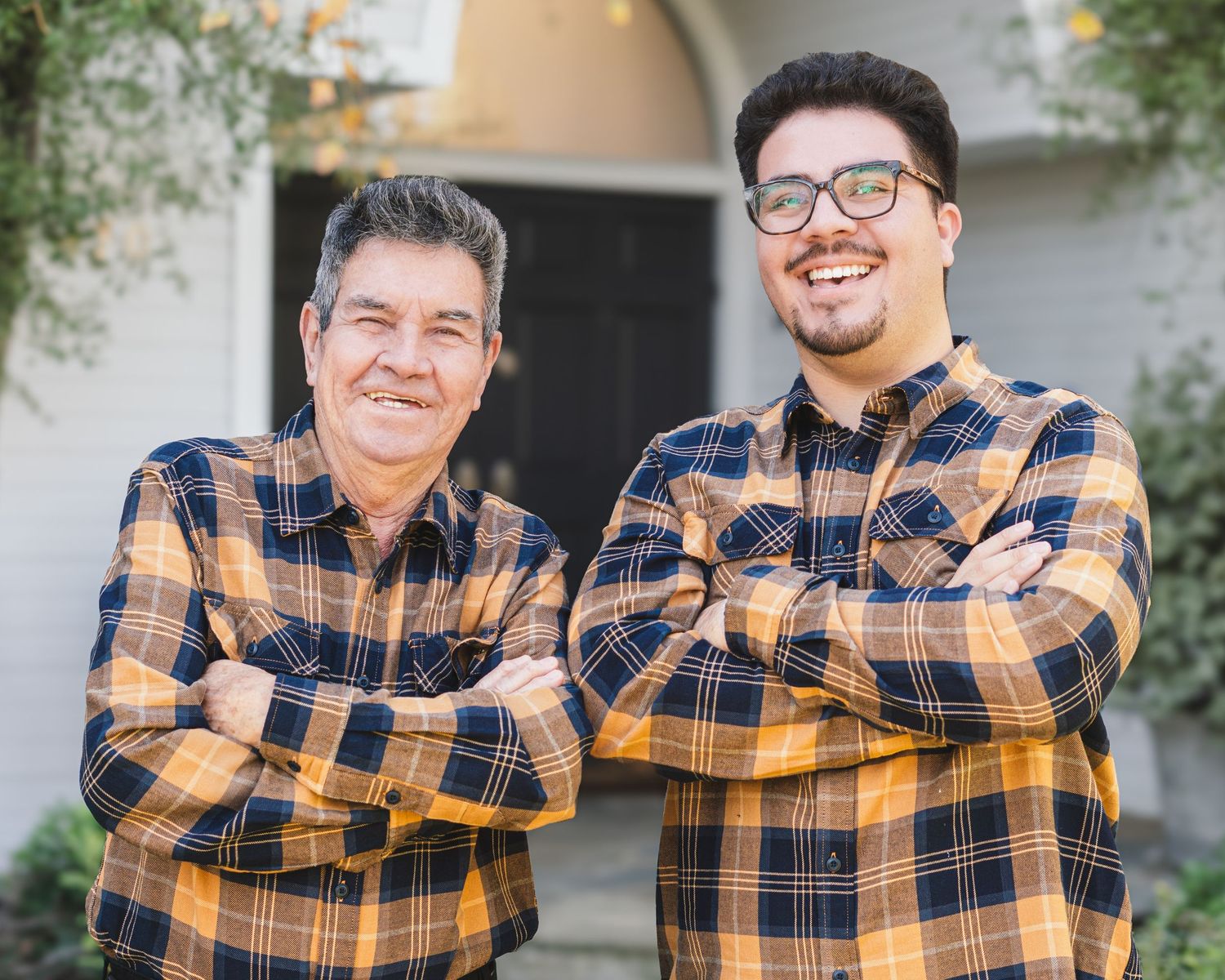 A series of five connected photos showing two people in matching plaid shirts posing together outdoors.