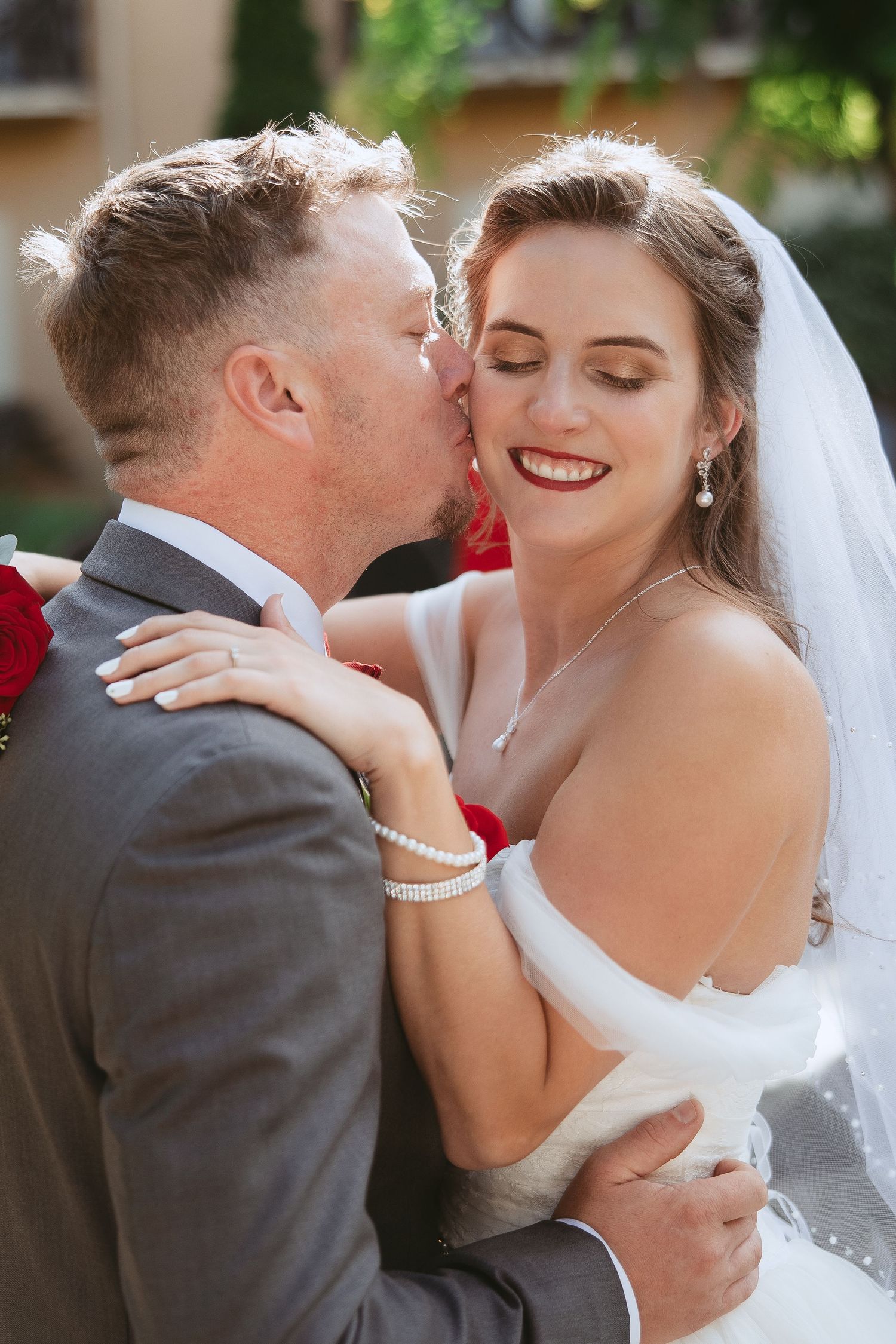 An intimate wedding portrait series showing tender moments between newlyweds.