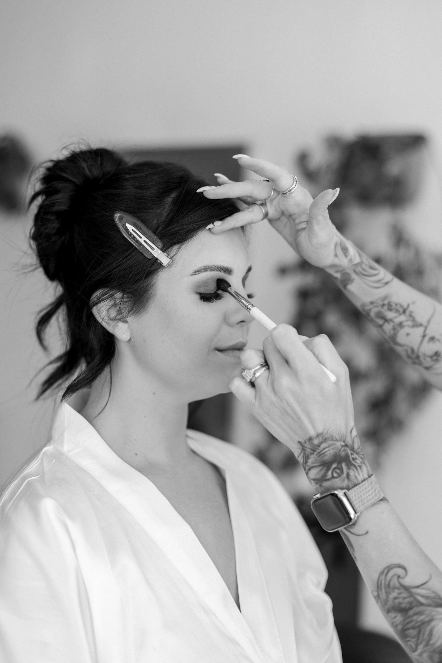 Black and white photo series showing preparation with dramatic lighting and tattoos.