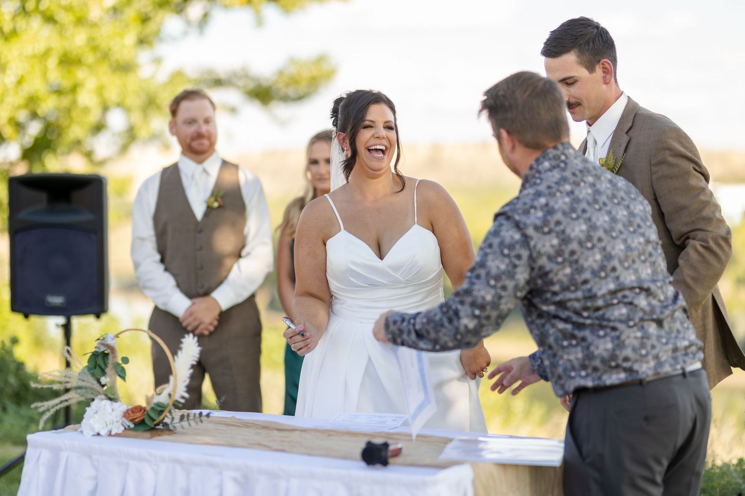 A collage of wedding celebration moments showing dancing, laughter and joyful interactions at an outdoor venue.