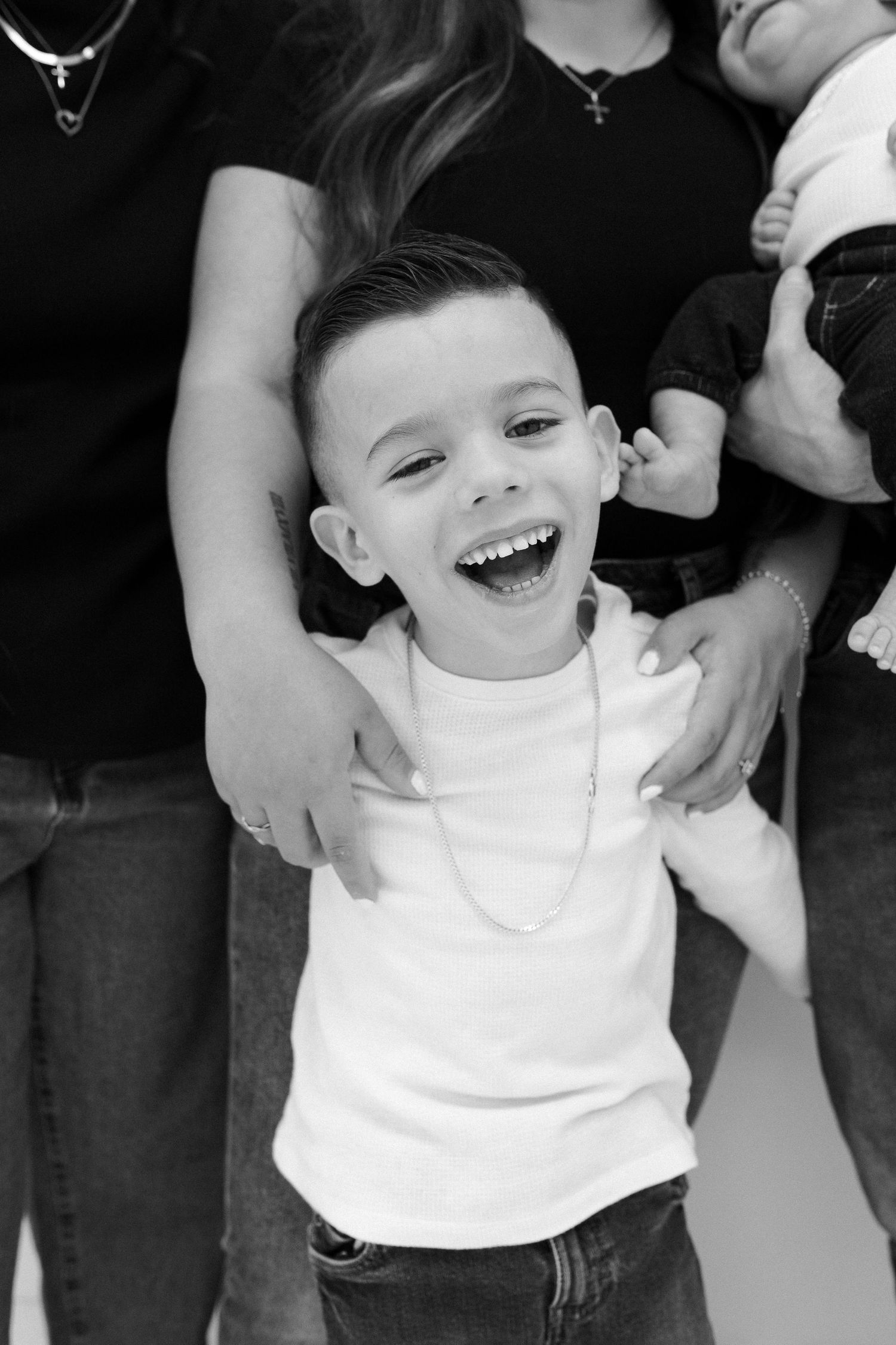 Black and white candid portraits showing joyful expressions.