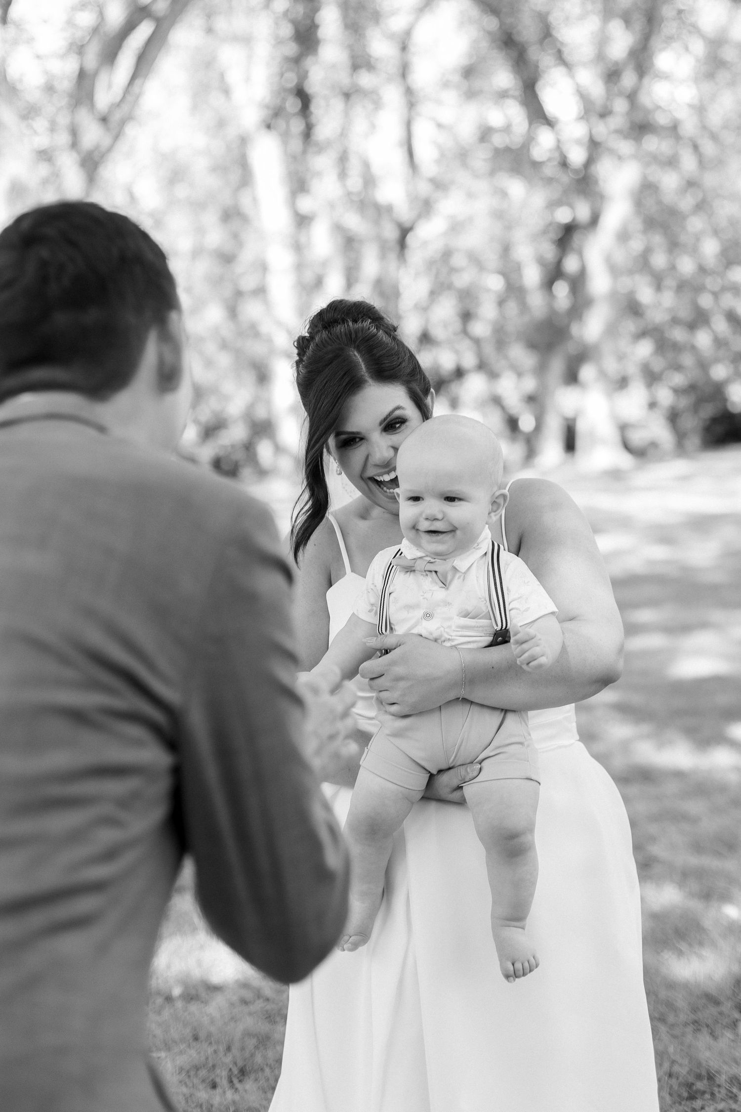 A heartwarming sequence of wedding photos showing a couple sharing joyful moments with a baby.