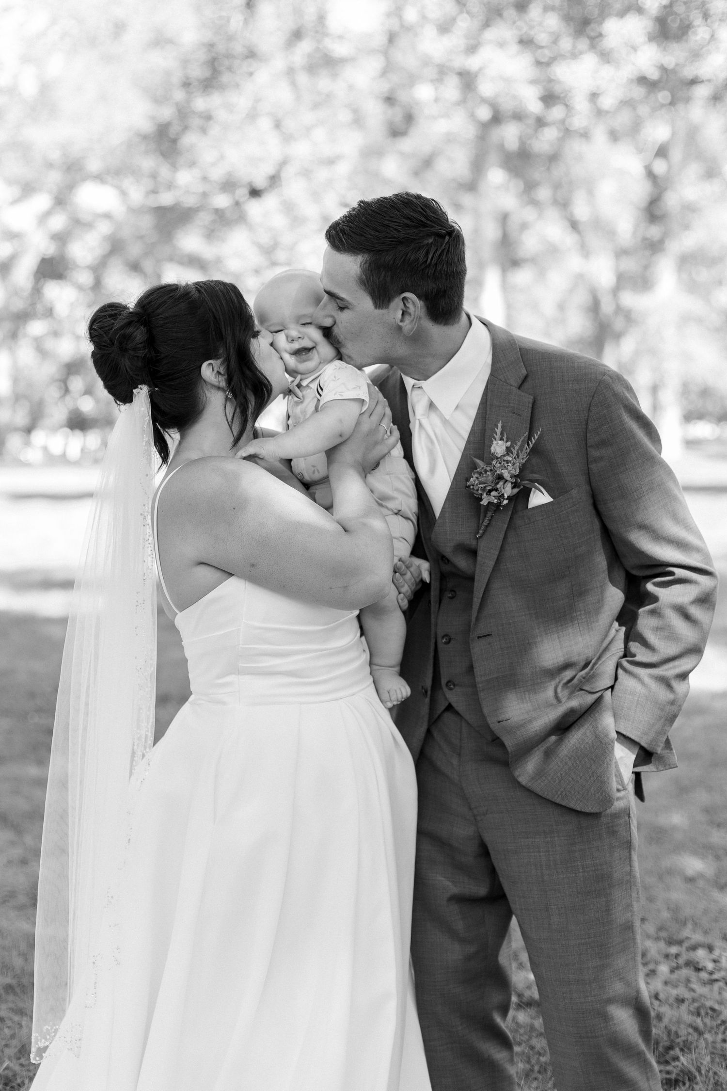 A series of romantic black and white wedding photos showing tender moments between a couple in formal attire.