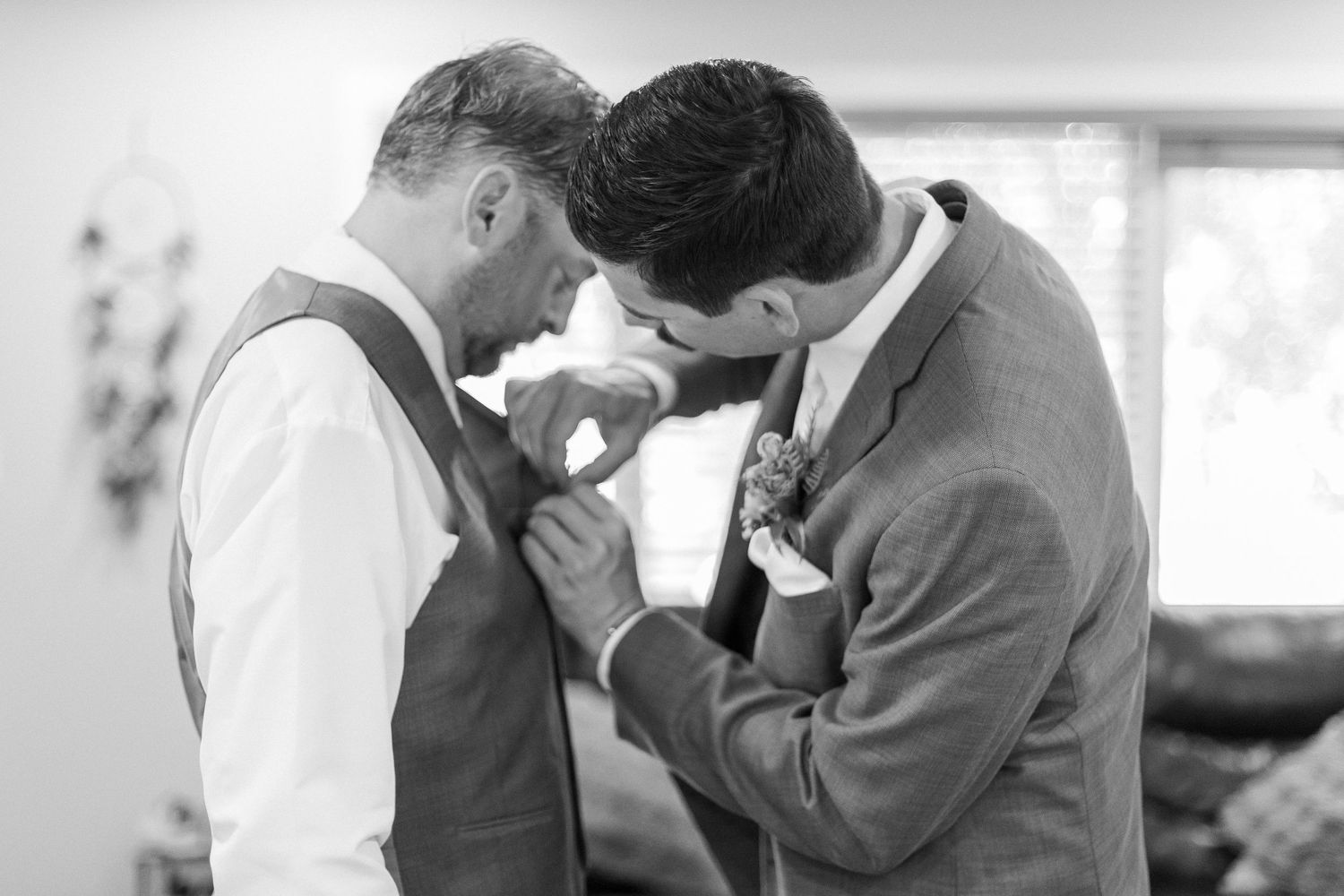 Wedding photographer capturing intimate moments of a couple during their special day.
