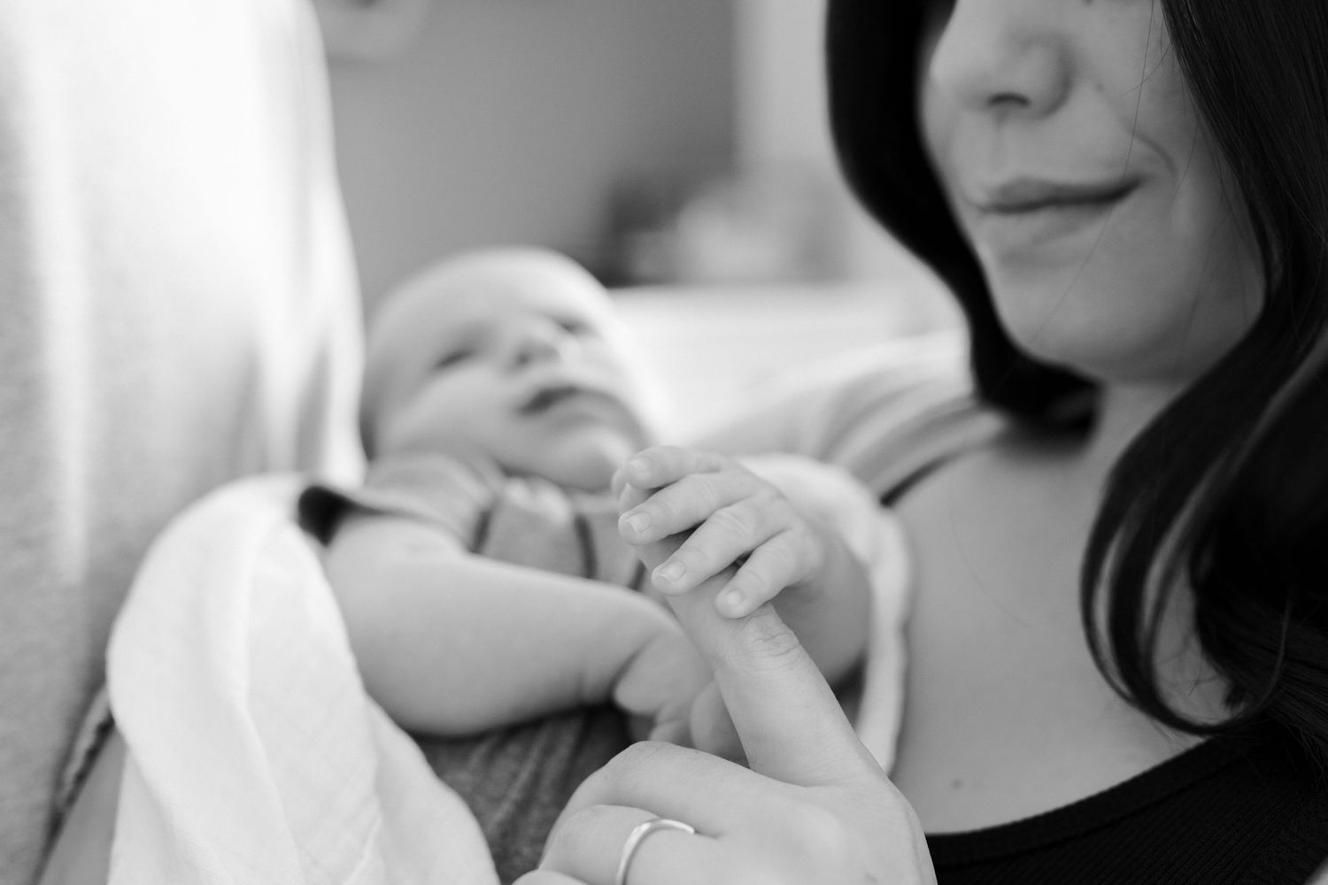 Black and white intimate portraits capturing gentle family moments.