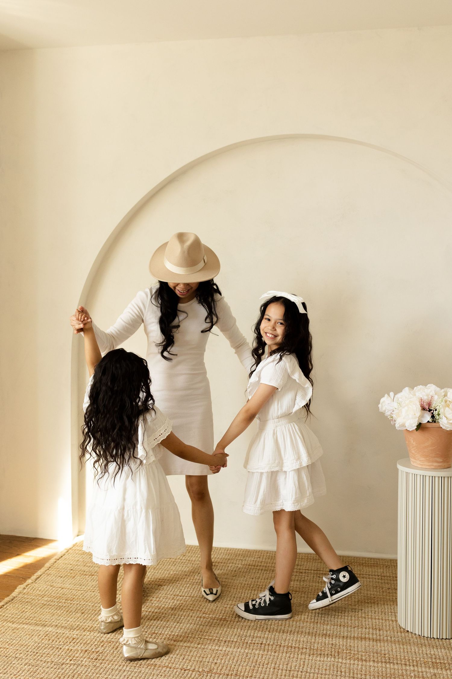 Playful interaction series captured against neutral backdrop with natural lighting.