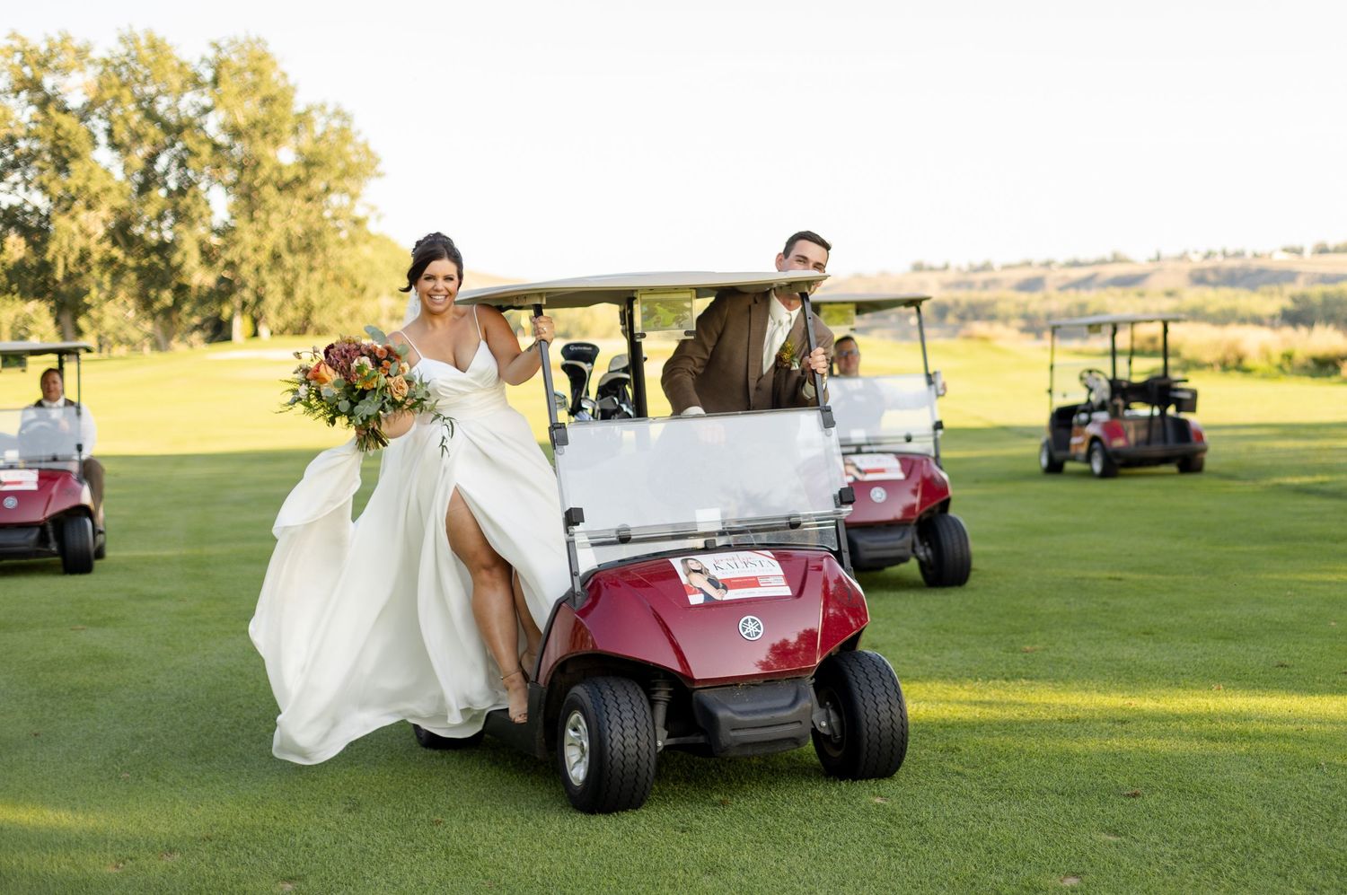 Golf carts transport wedding party across scenic course grounds.