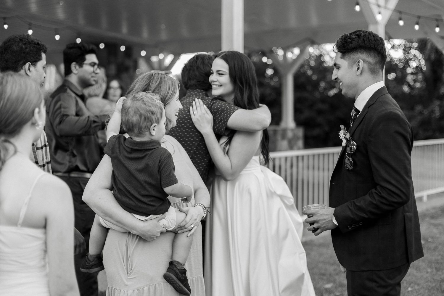 A collage of black and white wedding photos showing couples dancing and embracing at receptions.