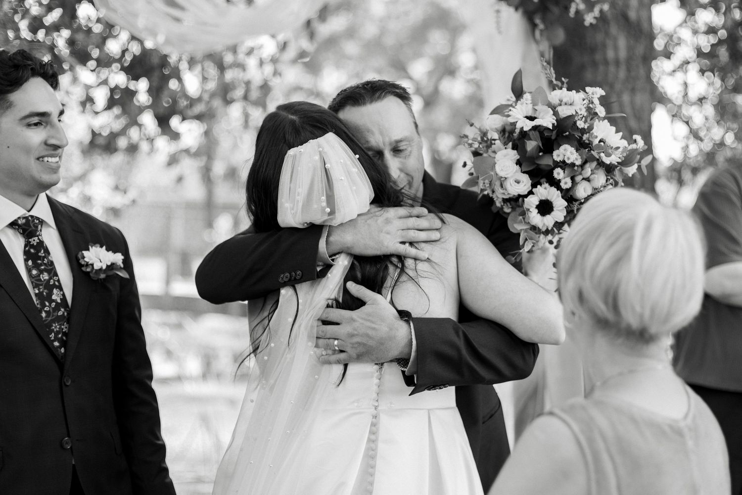 Black and white collage of wedding moments showing couples dancing and embracing during outdoor celebrations.