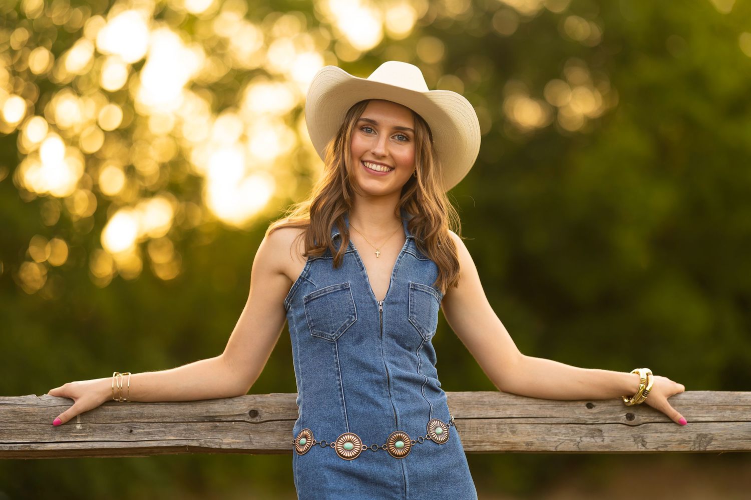Senior photo outfit denim dress and cowboy hat. Nature preserve - Frisco Texas.  Golden hour.