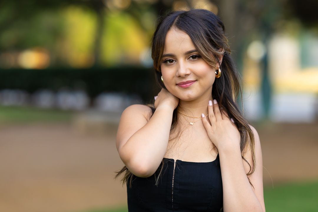 A woman in a black dress poses outdoors in a series of candid portraits with natural lighting and greenery in background.