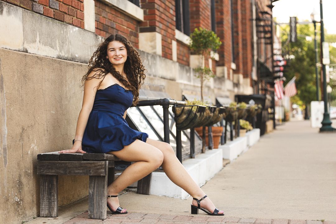 A series of urban street fashion photographs showing legs and feet in stylish footwear against brick and concrete backgrounds.