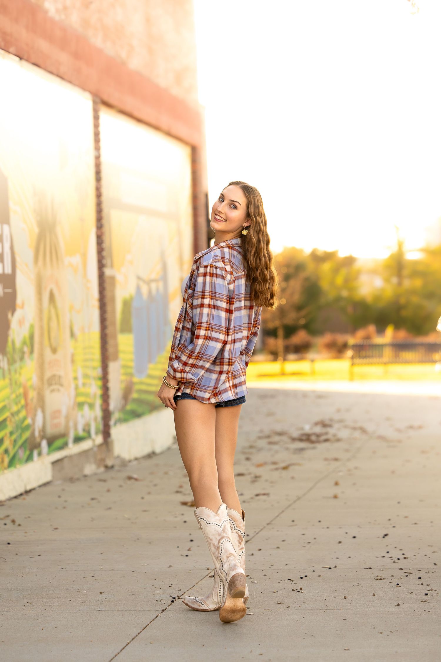 A sequence of photos showing someone in a plaid shirt and white boots walking along a concrete wall at sunset.