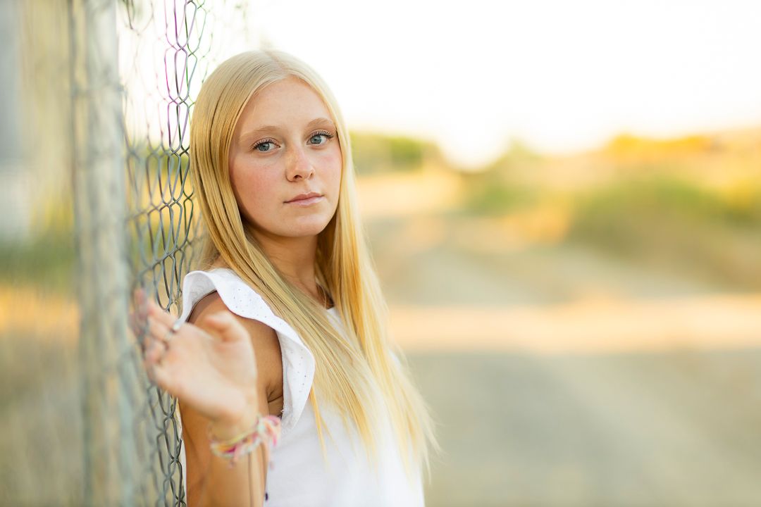 Artistic outdoor senior portraits series with soft lighting and natural location. Prosper Texas