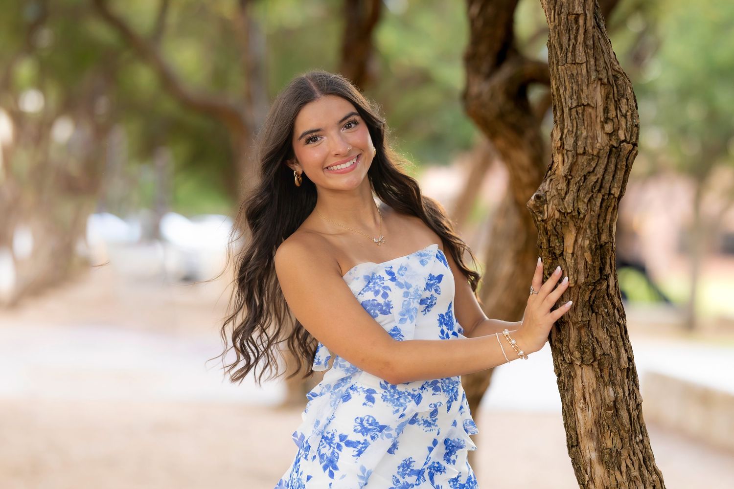 blue and white floral dress is what to wear.  Tips for senior pictures.  Frisco Texas.