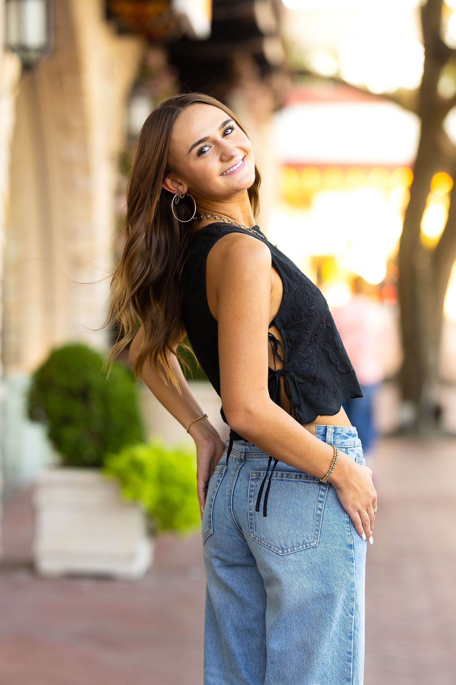 Senior Portraits Fashion portrait series showing denim jeans and black top at Highland Park Village.