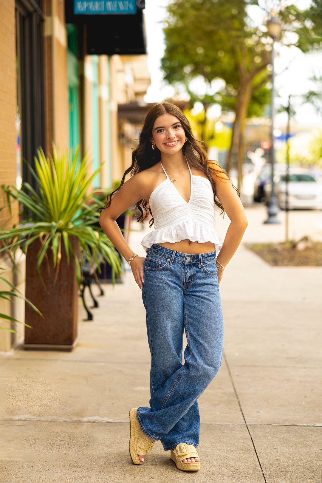 Casual street style photos in denim and white top by urban storefronts.