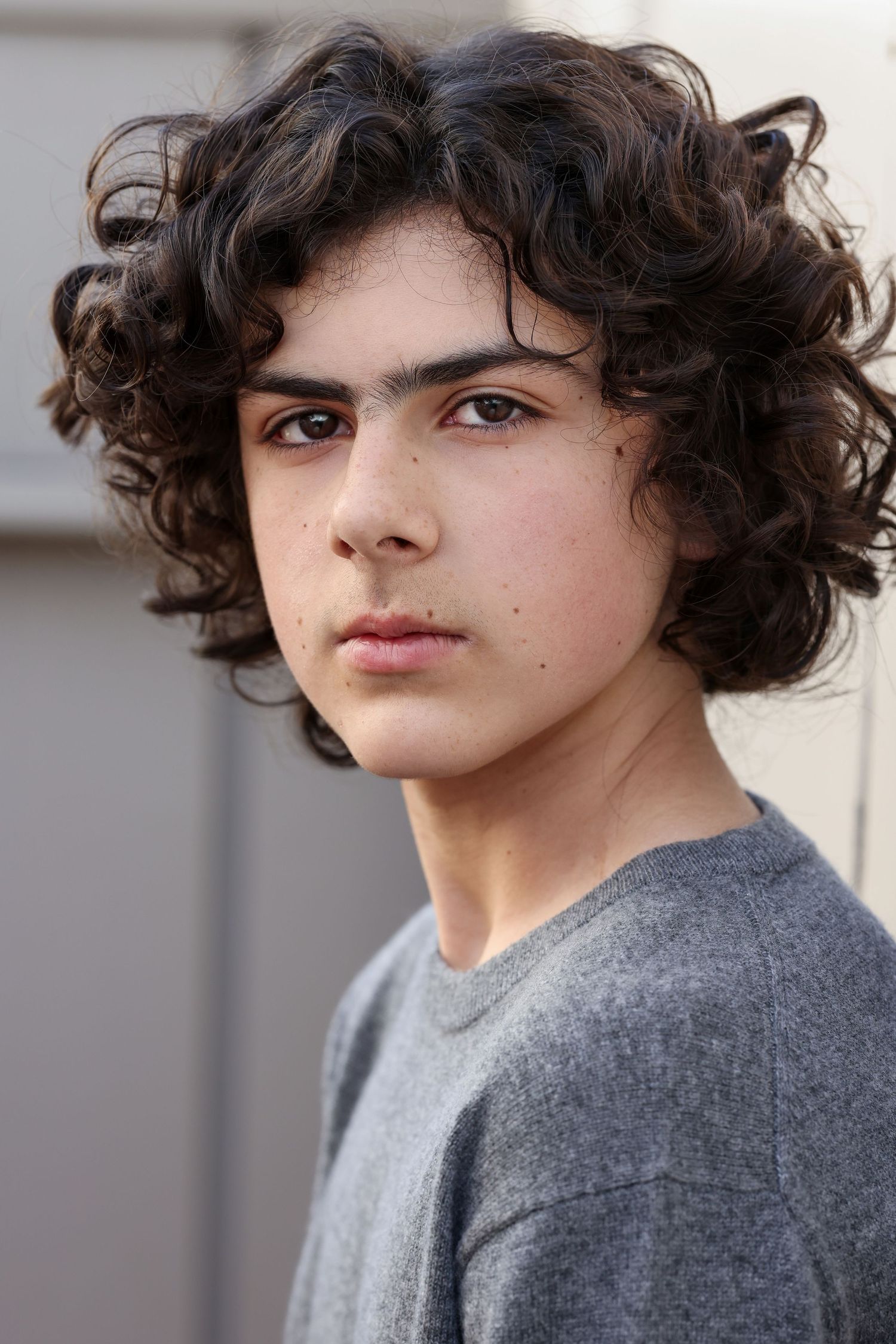 boy with curly hair headshot