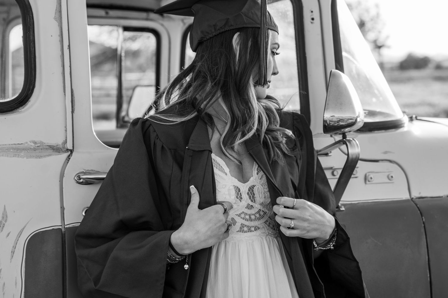 A series of black and white photos showing people interacting with vintage cars and trucks in casual settings.