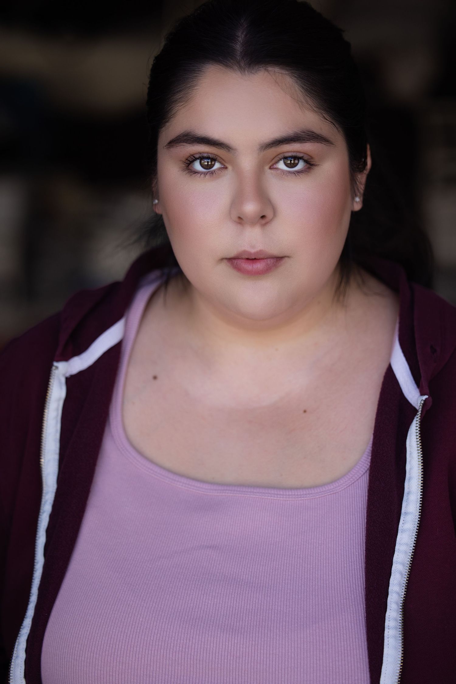 Casual portrait sequence in purple top and white hoodie.
