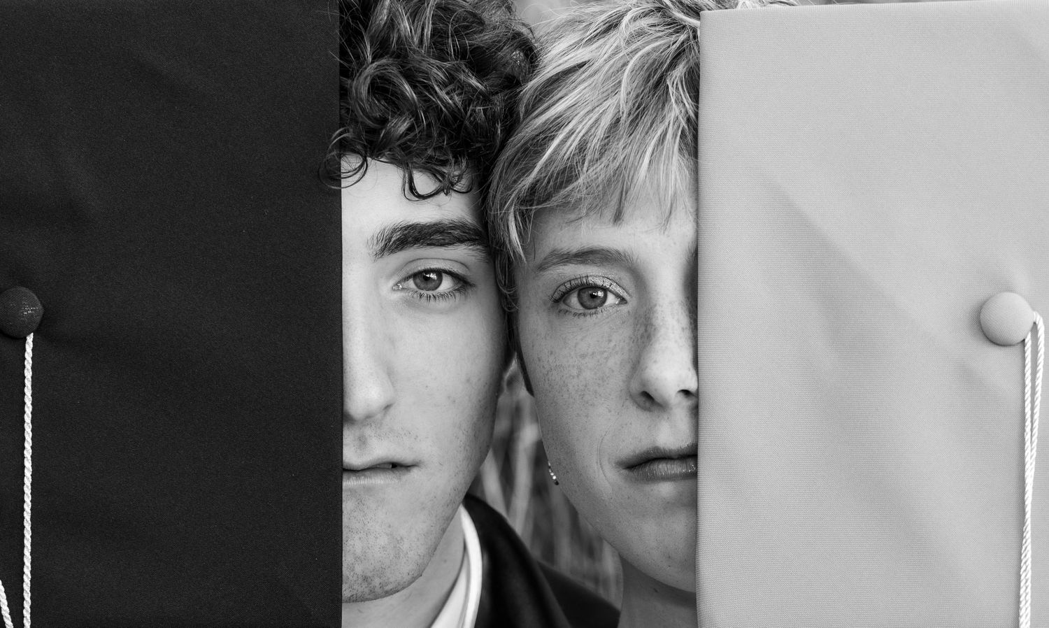 A black and white collage of headshots arranged in a horizontal strip.