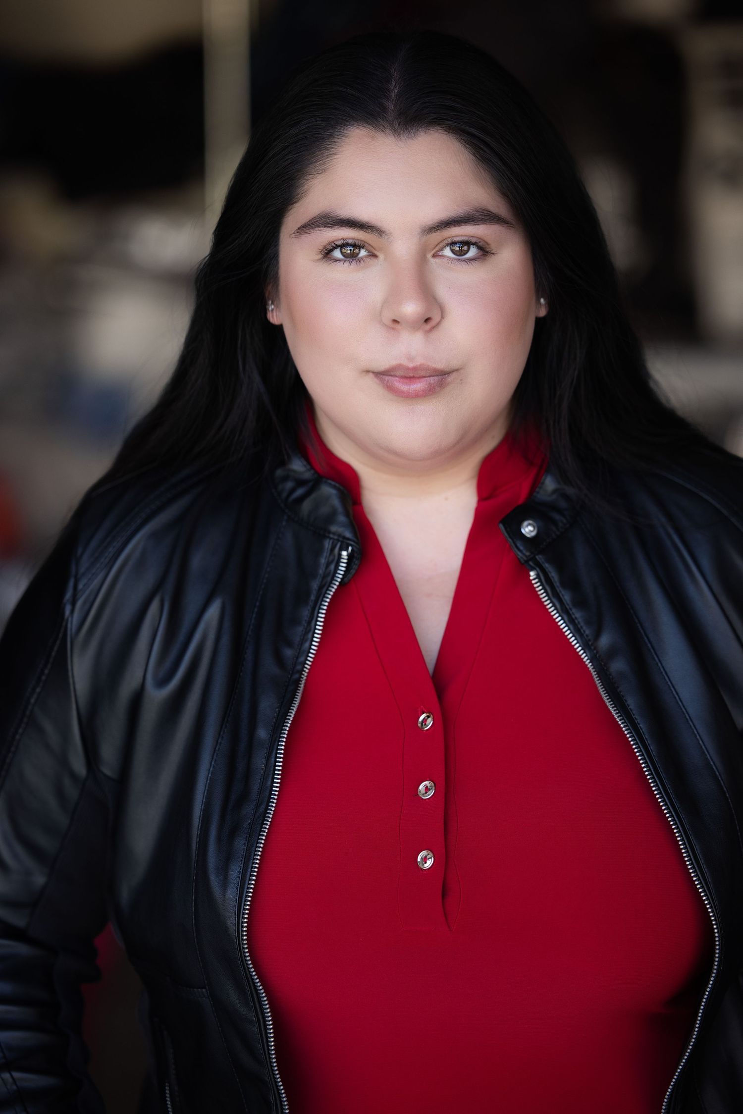 A portrait series shows someone wearing a black leather jacket and red top against a dark background.