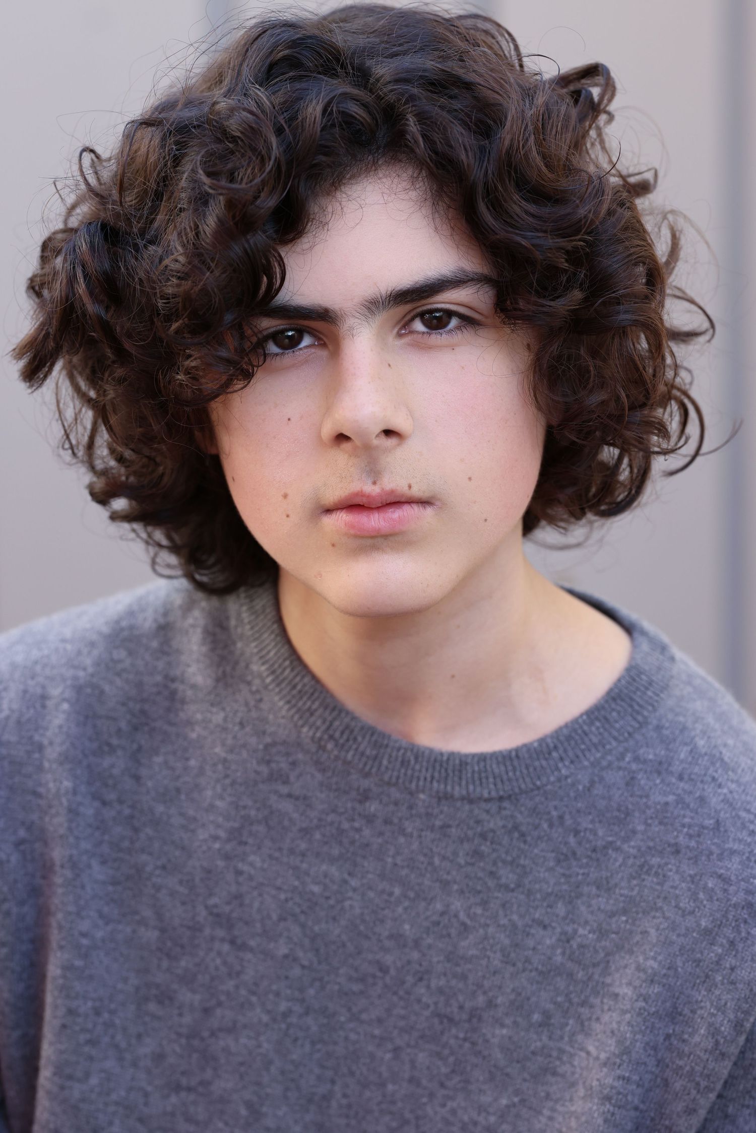 theatrical headshot for teen boy with curly hair