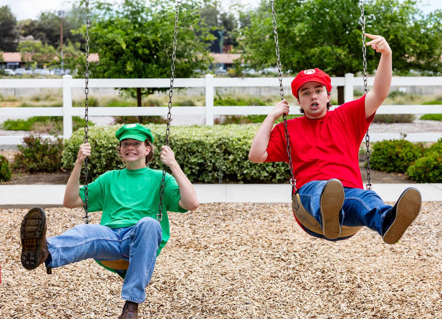 A sequence of action shots showing someone swinging and flipping on a playground tire swing.