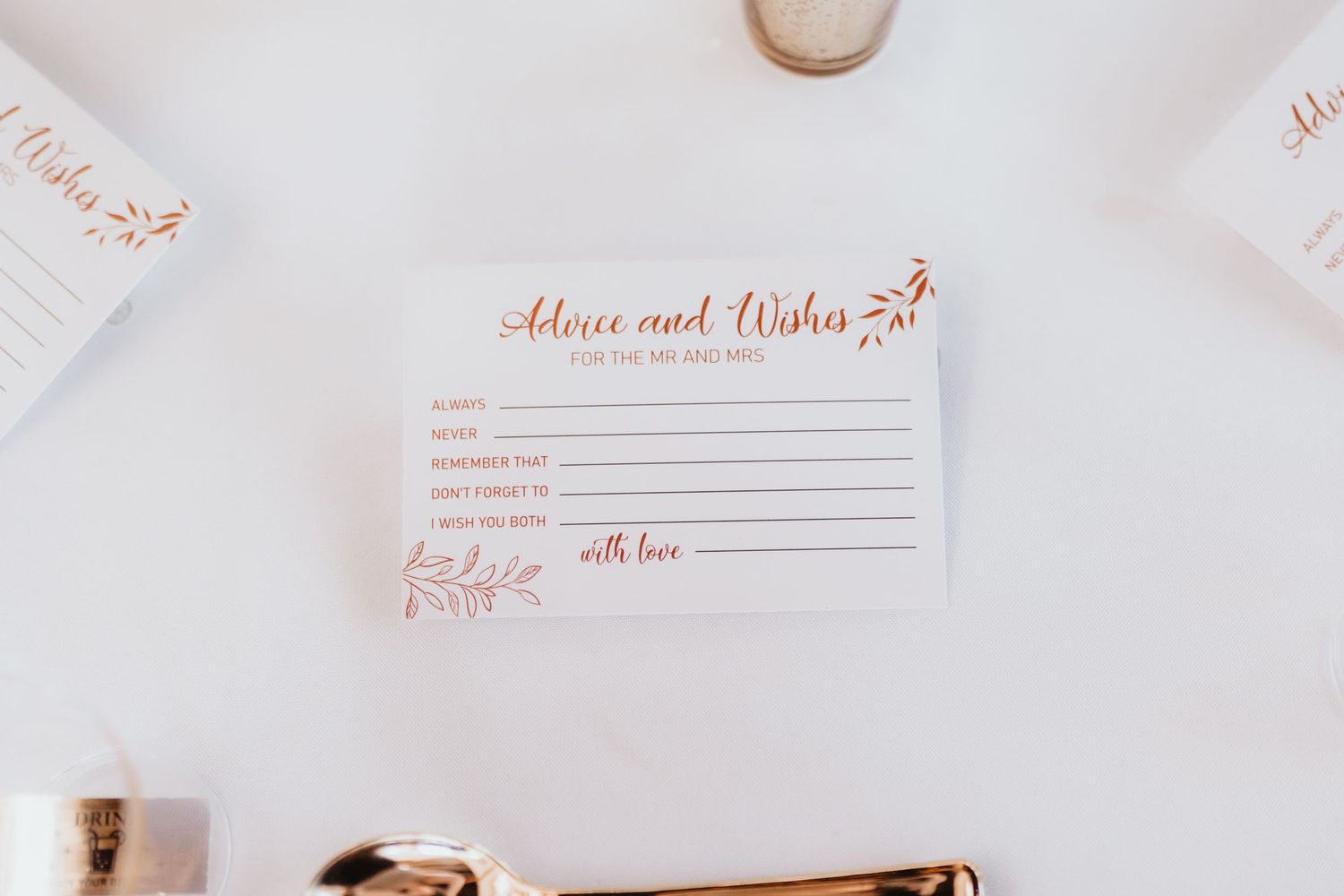 Elegant rose gold printed advice and wishes card for wedding guests displayed on white background.