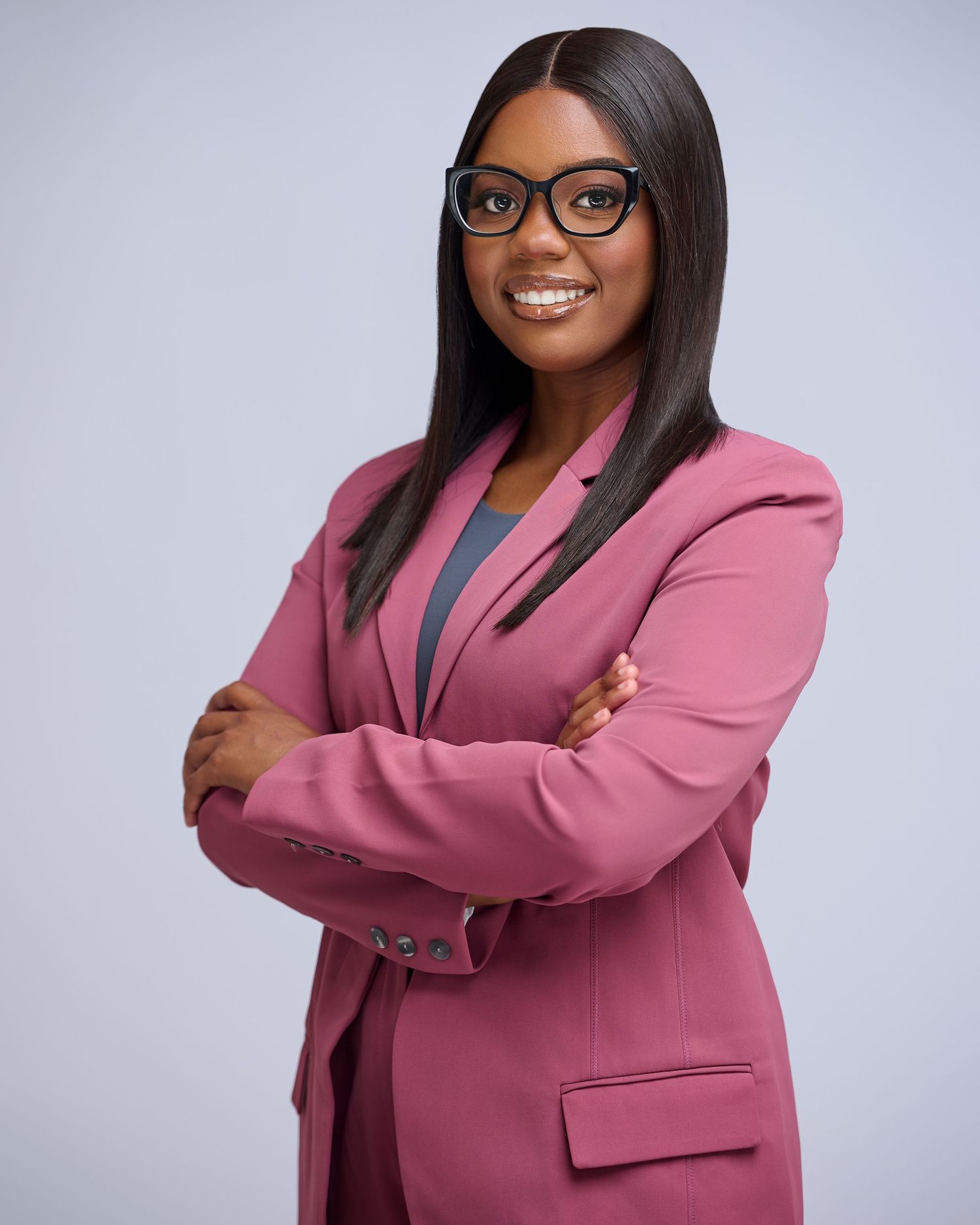 Professional portrait series showing a woman in a pink blazer against a gray background.