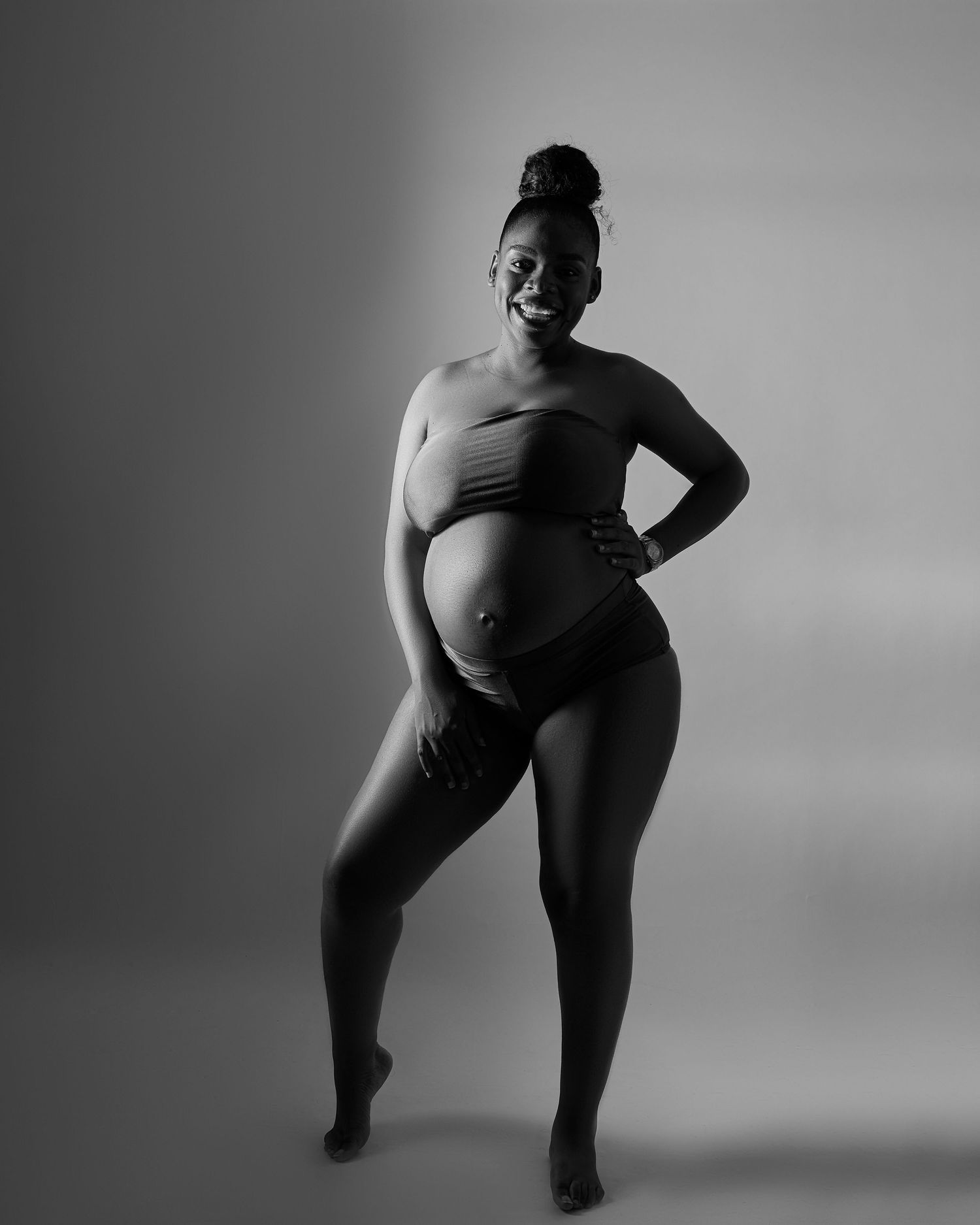 A series of black and white artistic photographs showing a figure in dynamic dance poses against a simple background.