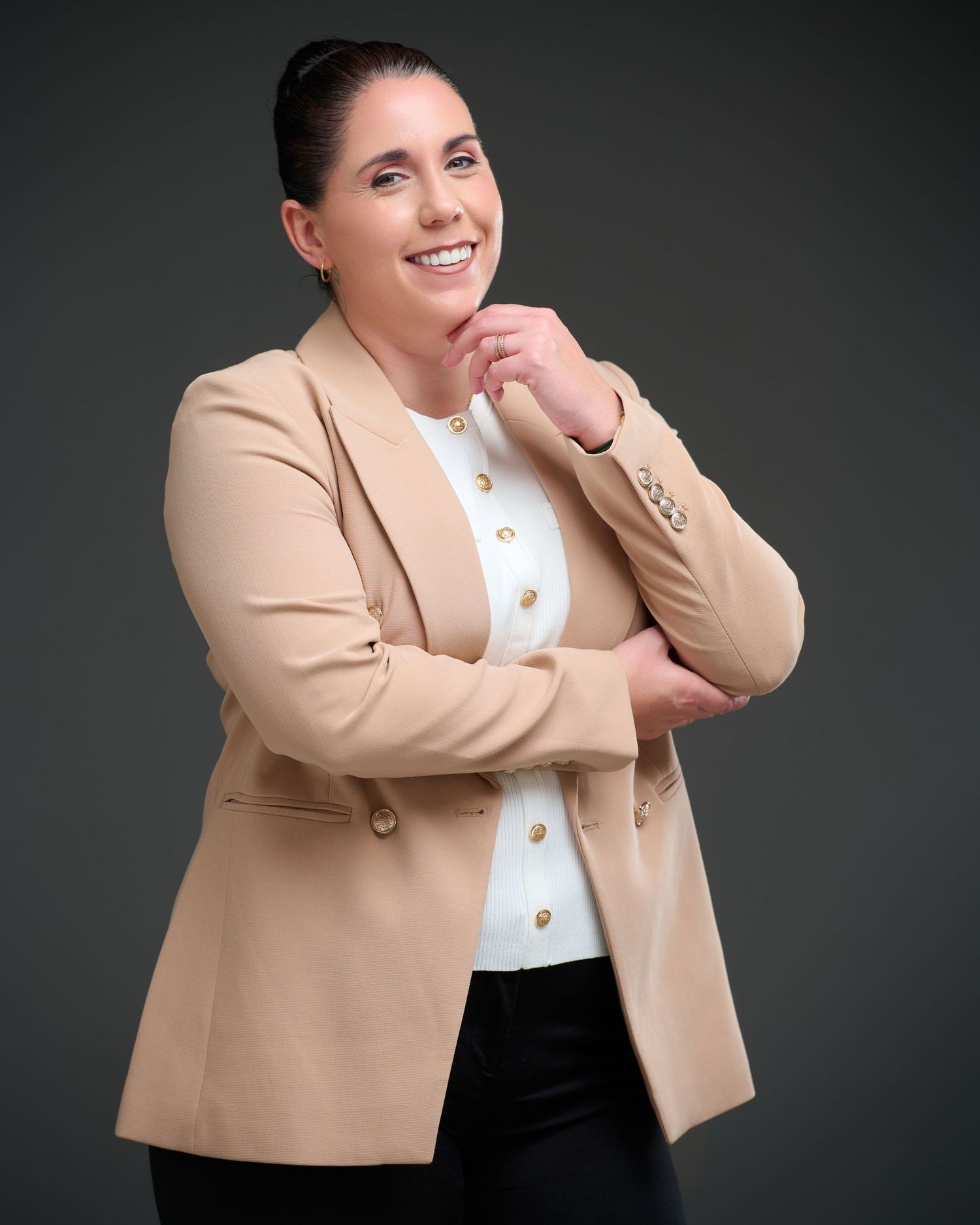 Professional portrait in business attire showing confident pose against dark background in multiple angles.
