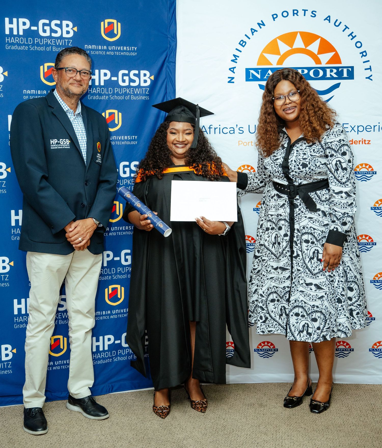 Graduate receives certificate from two officials at HP-GSB Namibian Ports Authority ceremony.