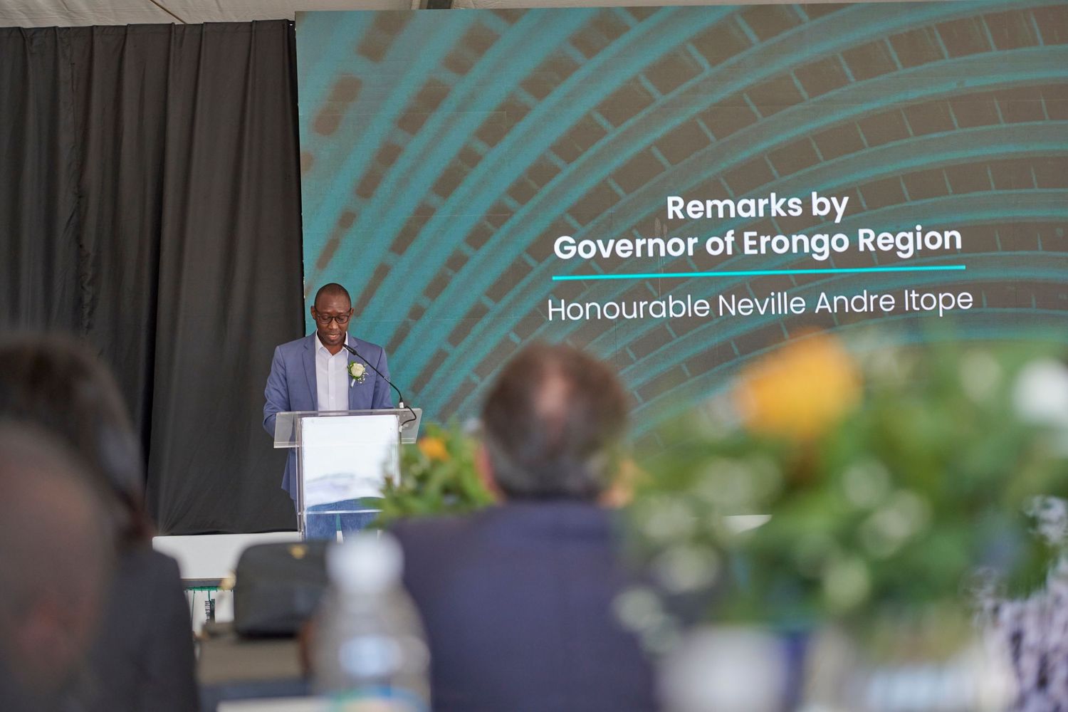Governor Neville Andre Itope delivering remarks at a podium during an official Erongo Region event.