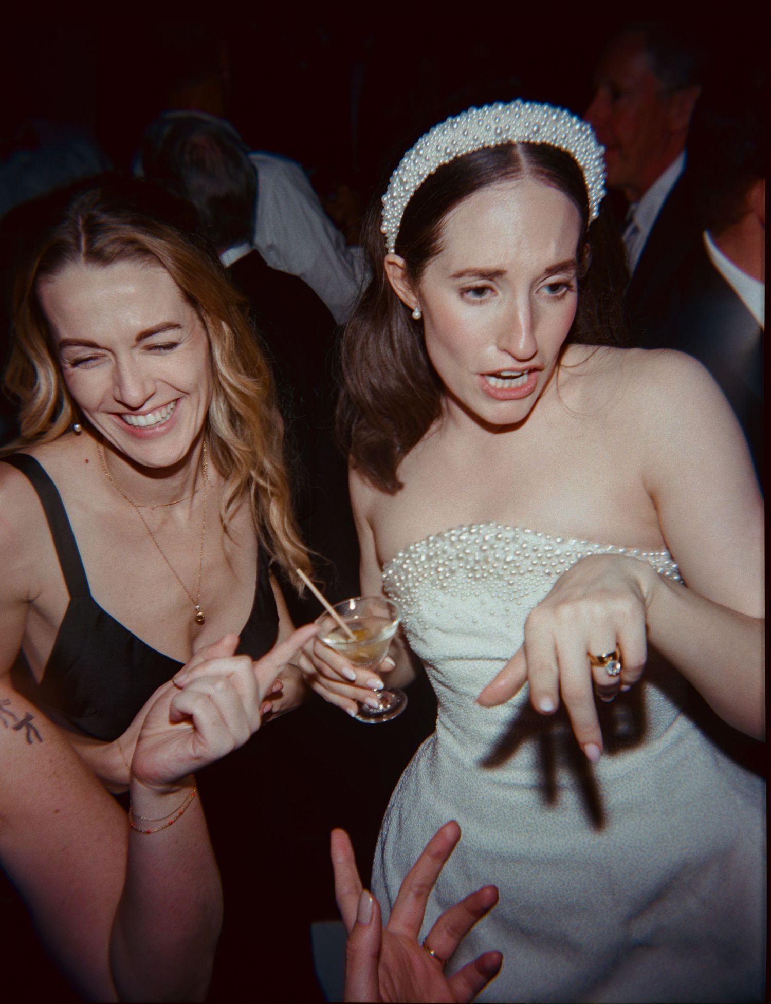 A sequence of candid party photos showing people dancing and celebrating at a dimly lit reception or nightclub event.