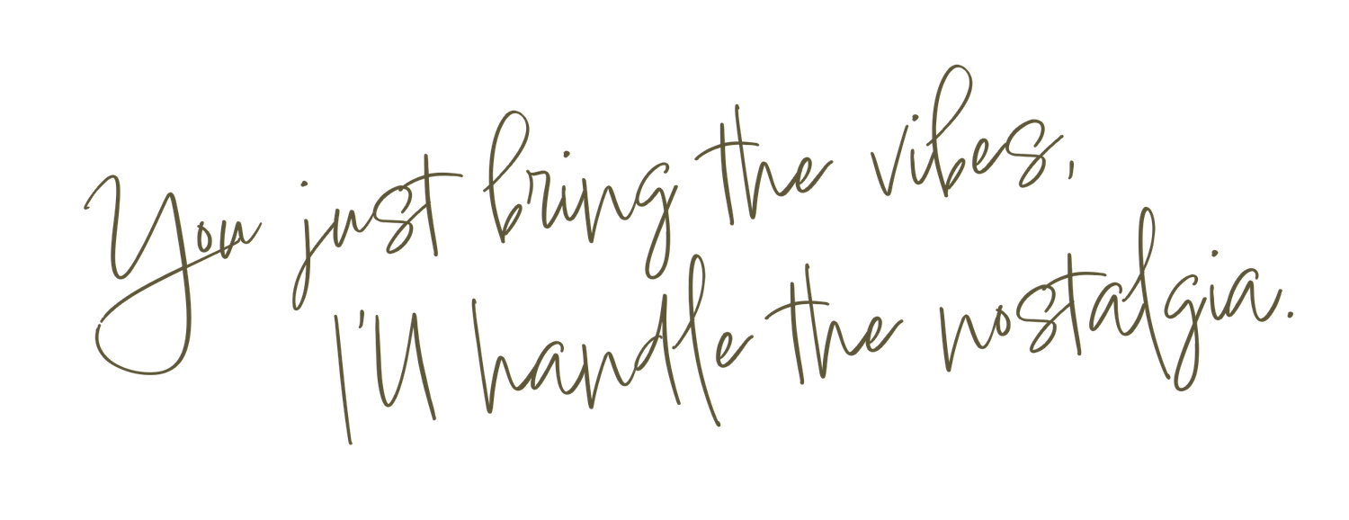 Handwritten text in black ink on white paper reads 'Now just bring the vibes' with additional cursive writing.