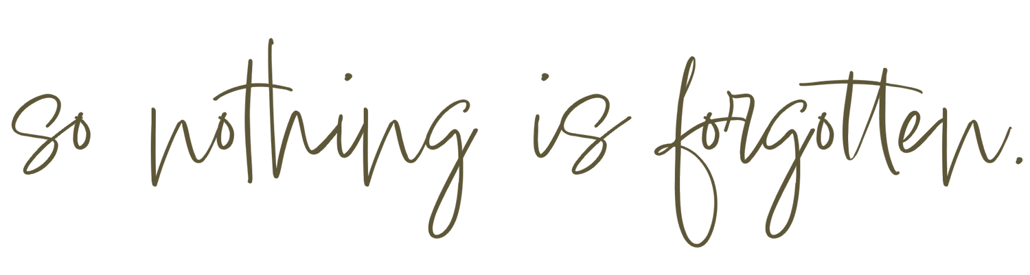 Handwritten cursive text in black ink reads 'So nothing is forgotten' on a light background.