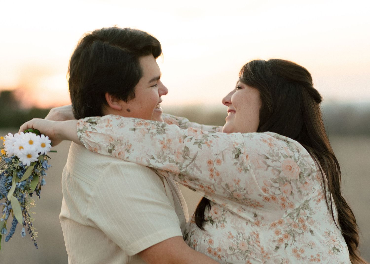 Expecting couple embracing during maternity session with a Belton Texas maternity photographer