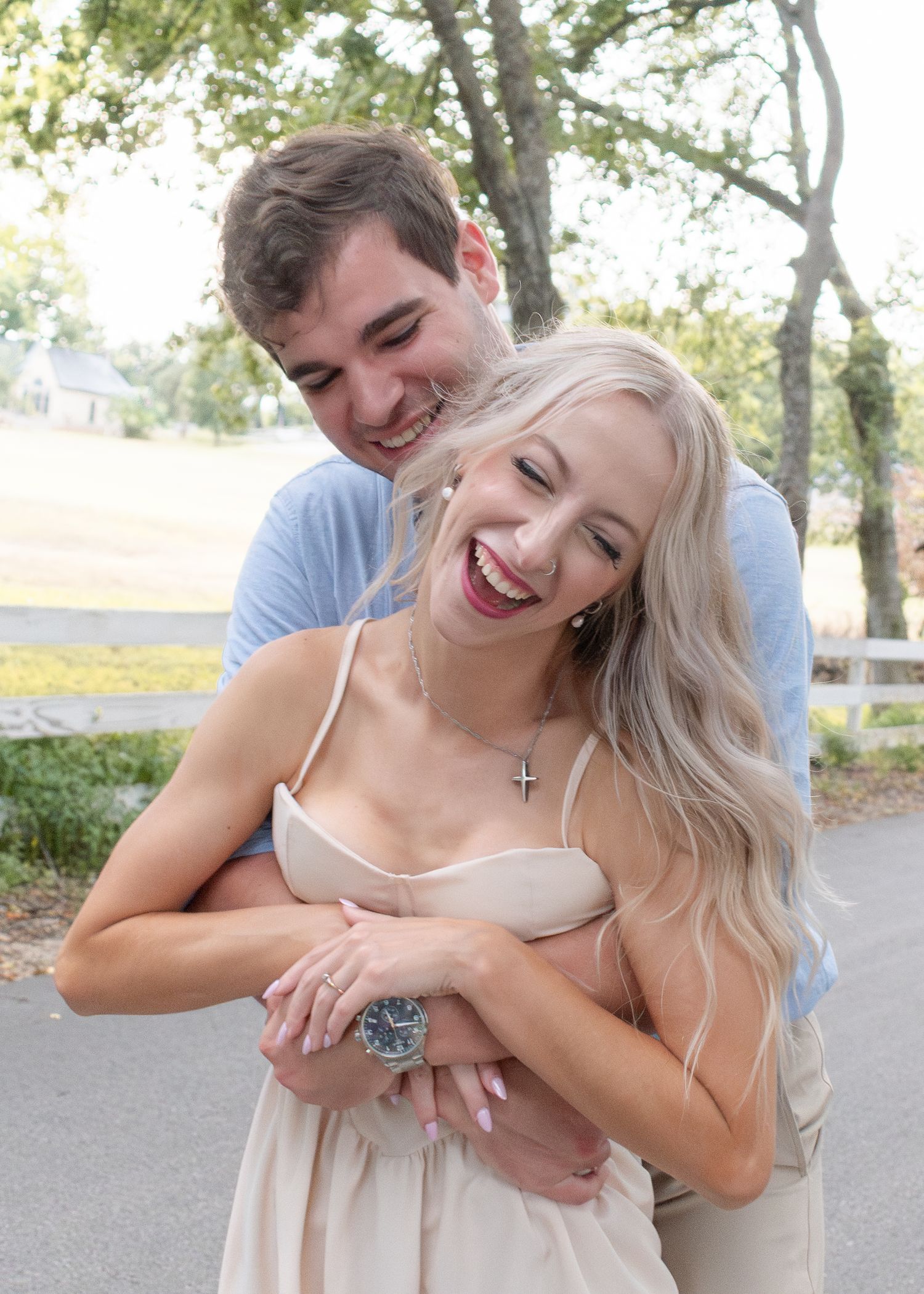 Couple laughing together during outdoor session in Salado Texas with a family photographer