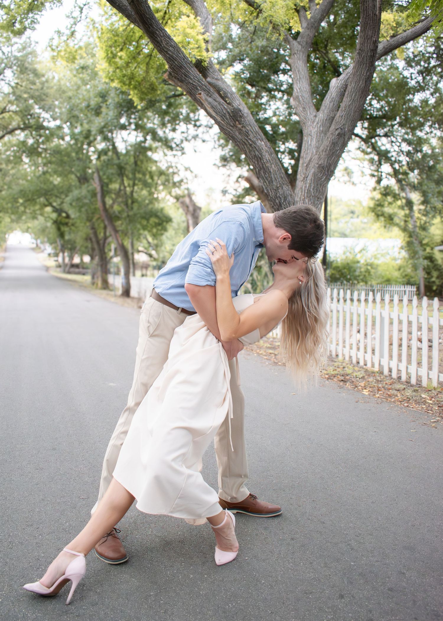Couple dancing in the street during session with a Belton Texas family photographer