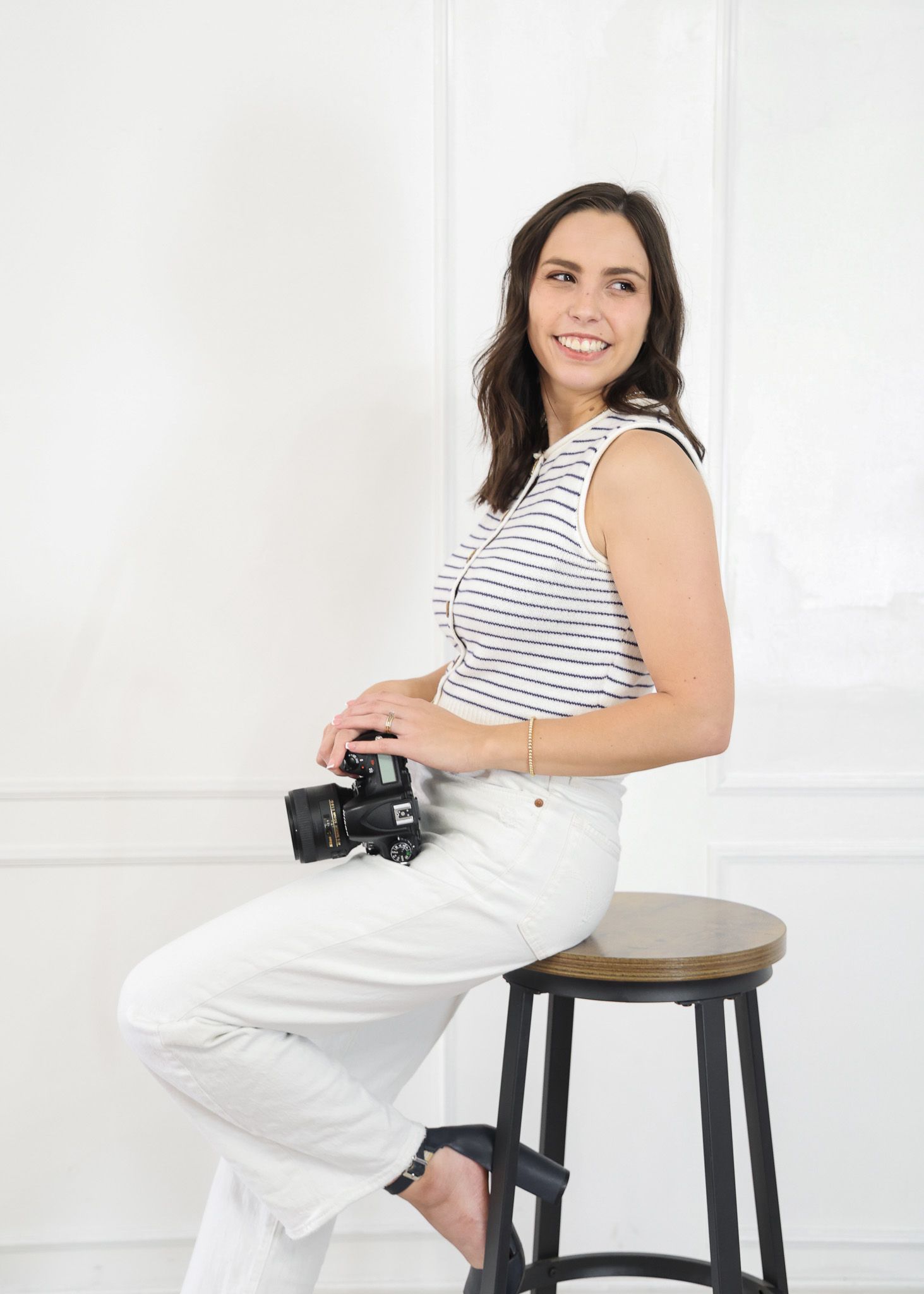 Belton Texas family photographer smiling with camera in studio