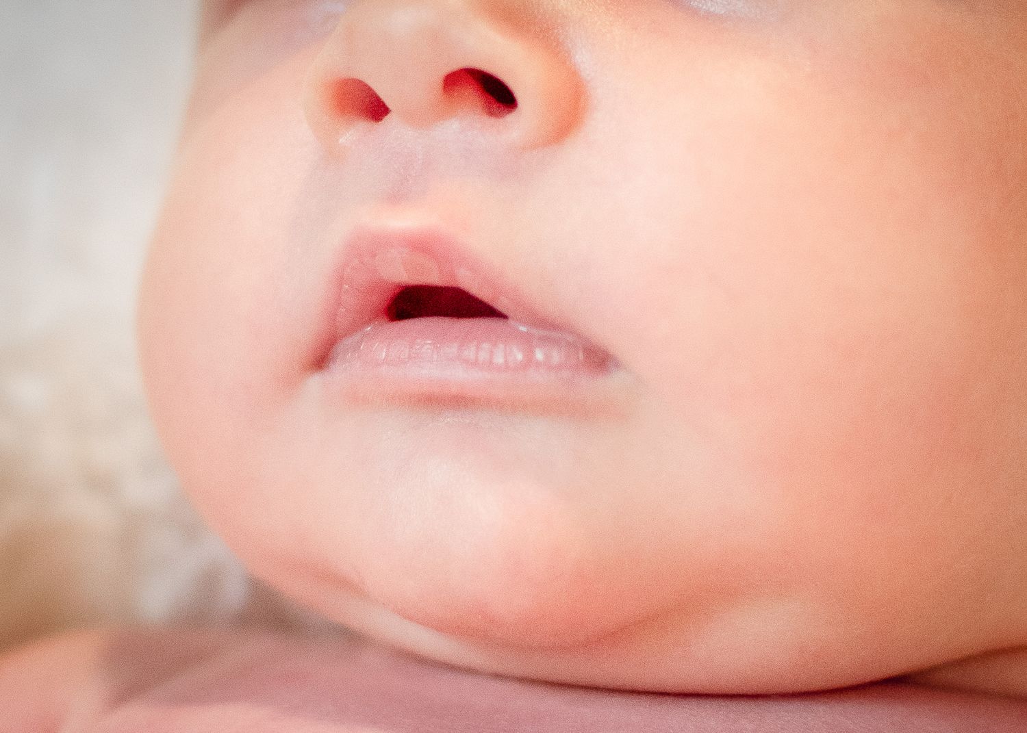 Close-up of newborn baby lips and chin during natural light newborn session in Belton Texas
