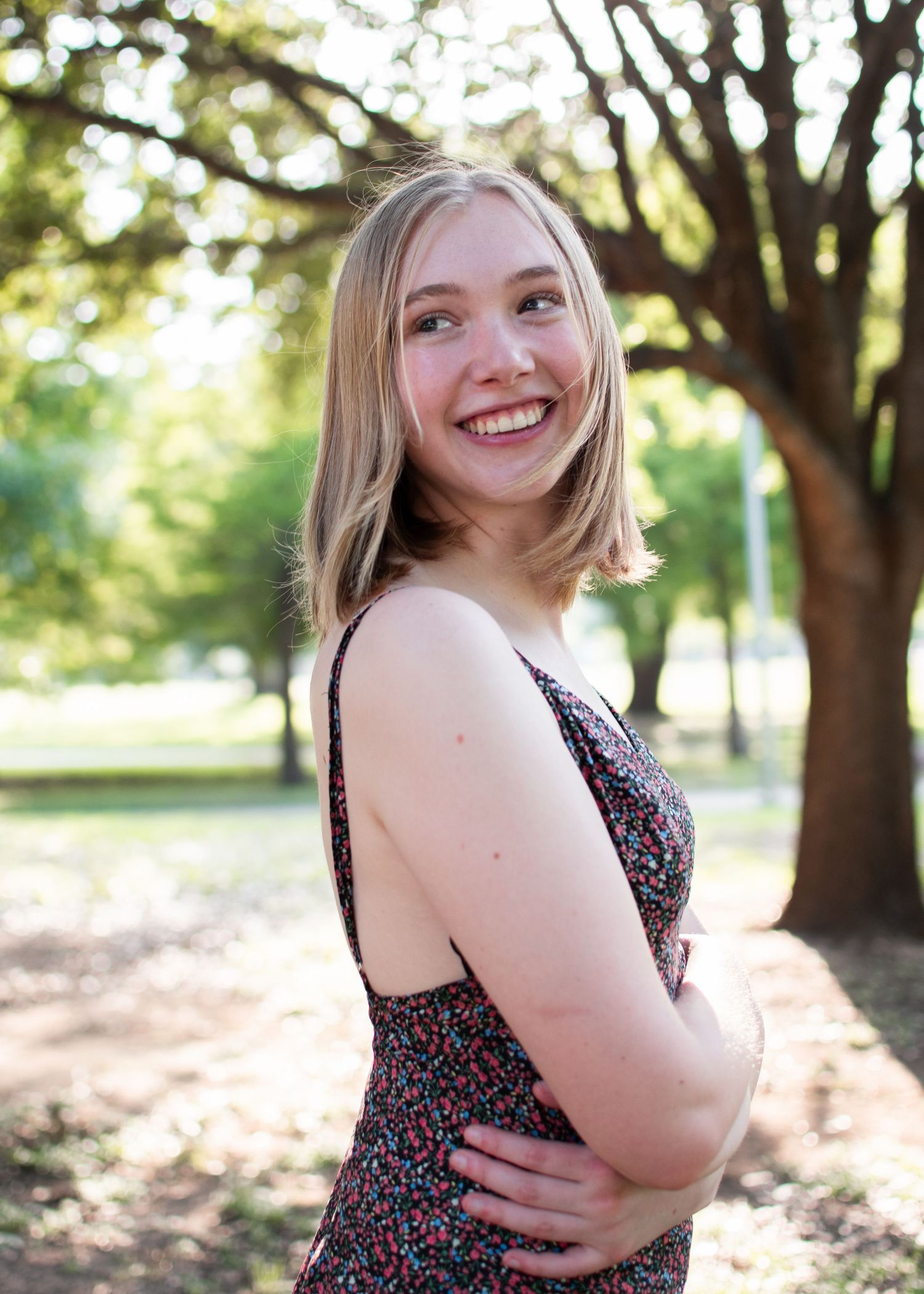 High school senior smiling during outdoor session at Butler Park in Austin Texas
