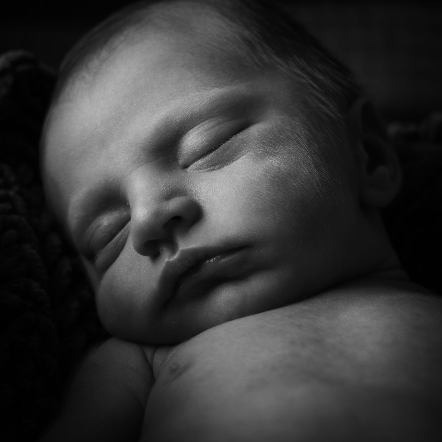 Black and white portrait of sleeping newborn baby during session in Belton Texas