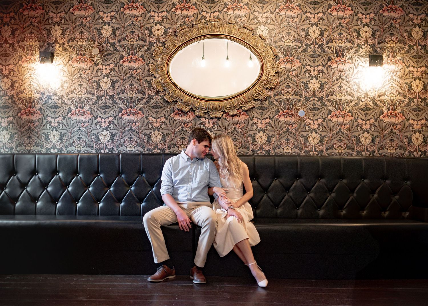 Couple sitting together at Greenfields Coffee in Salado Texas during lifestyle session with a family photographer