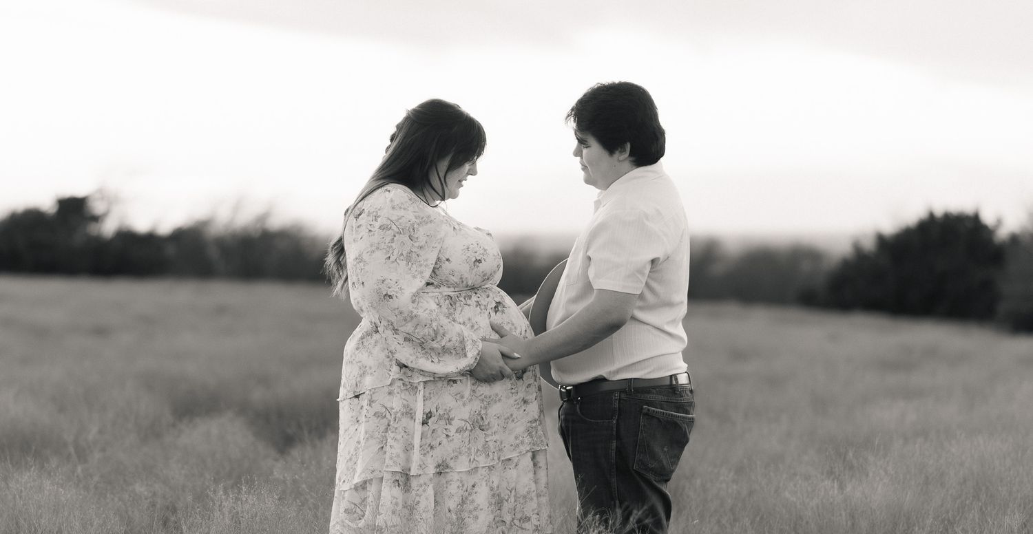 Expecting couple praying together during maternity session with a Belton Texas maternity photographer