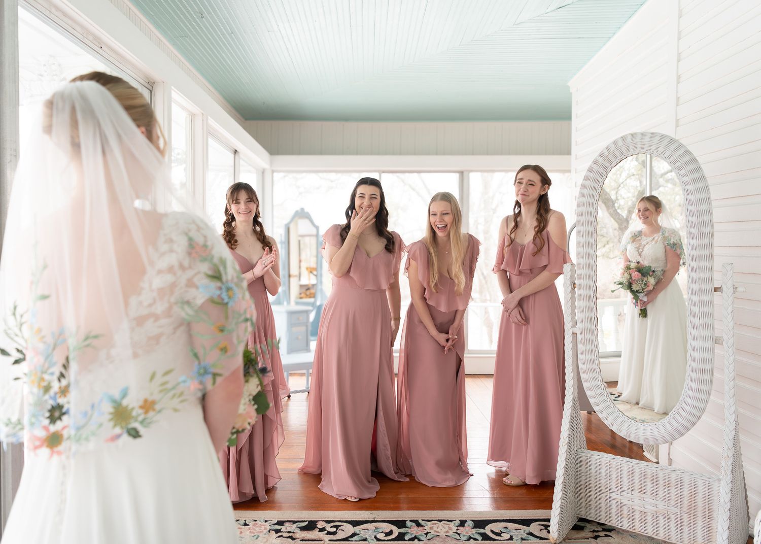 Bridesmaids reacting to bride during first look at Winfield Inn in Dripping Springs Texas