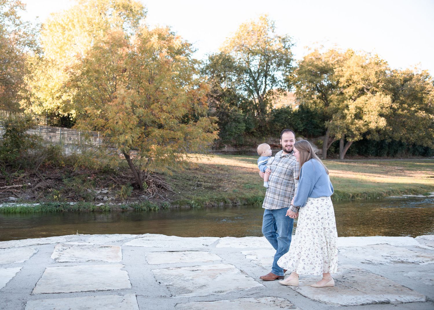 Family walking together during session at Nolan Creek in Belton Texas
