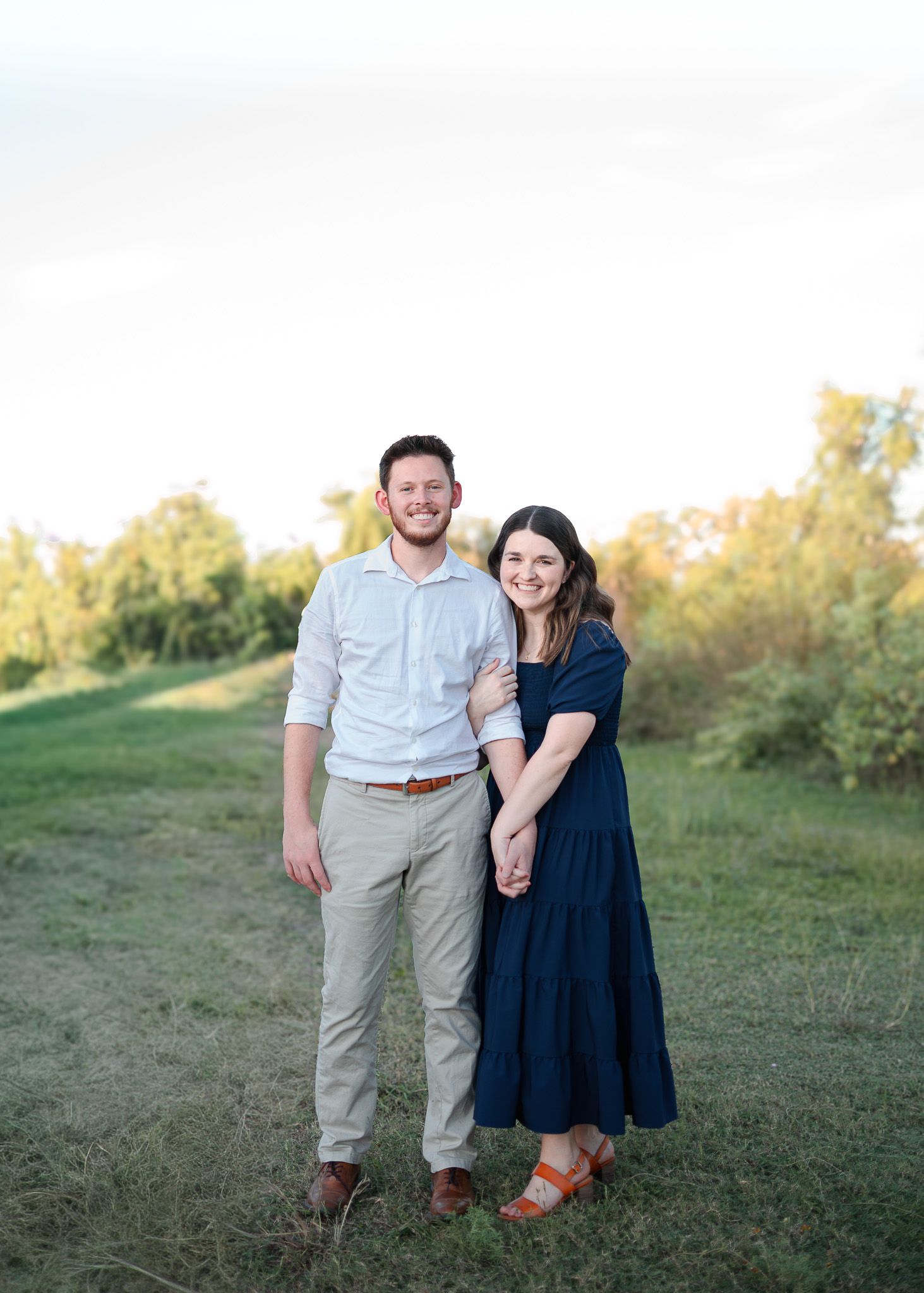 Couple standing together during outdoor session at Salado Creek in Salado Texas