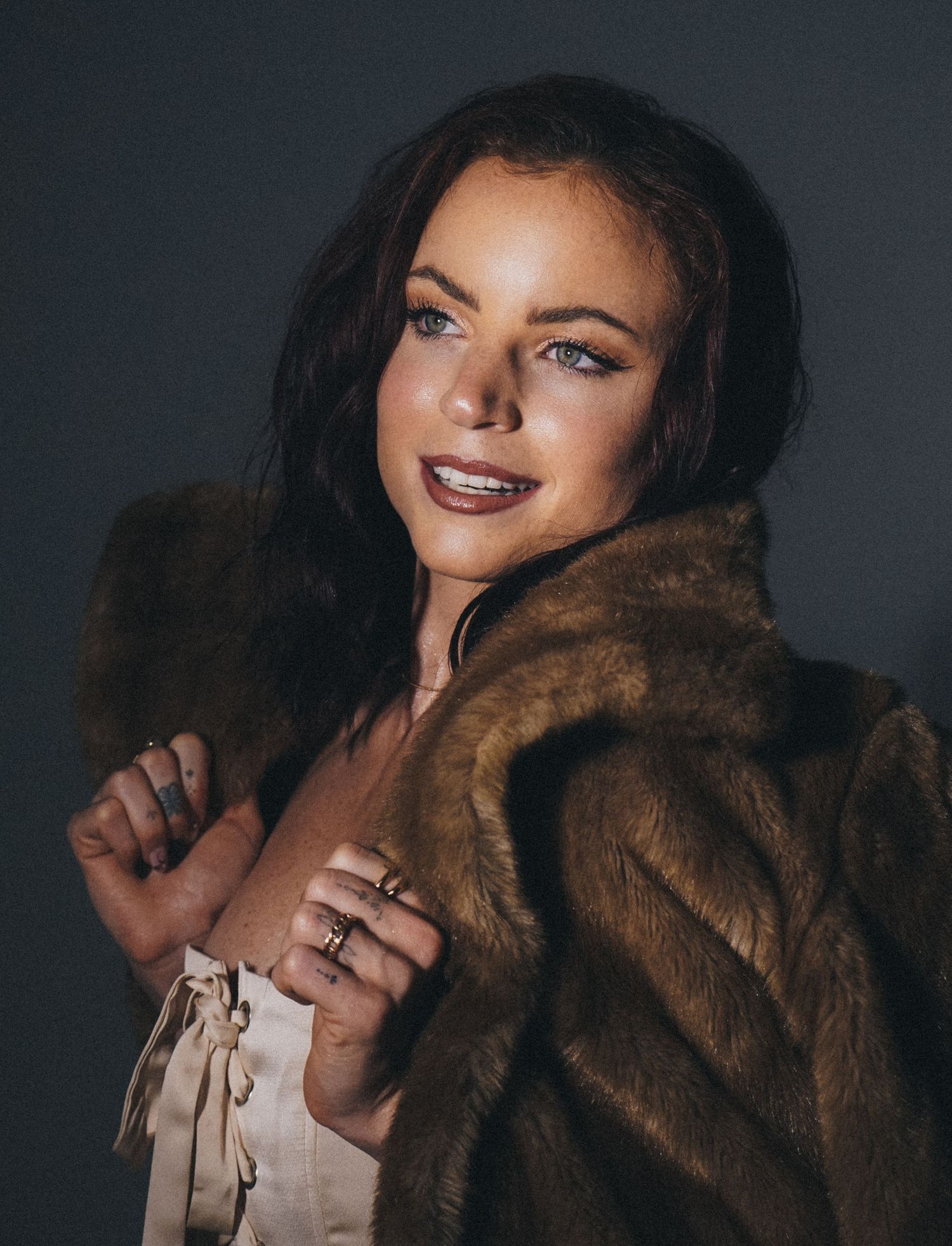 Fashion portrait with brown fur coat and glamorous makeup.